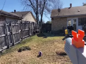 aiming in the backyard with splatter gun SRB400